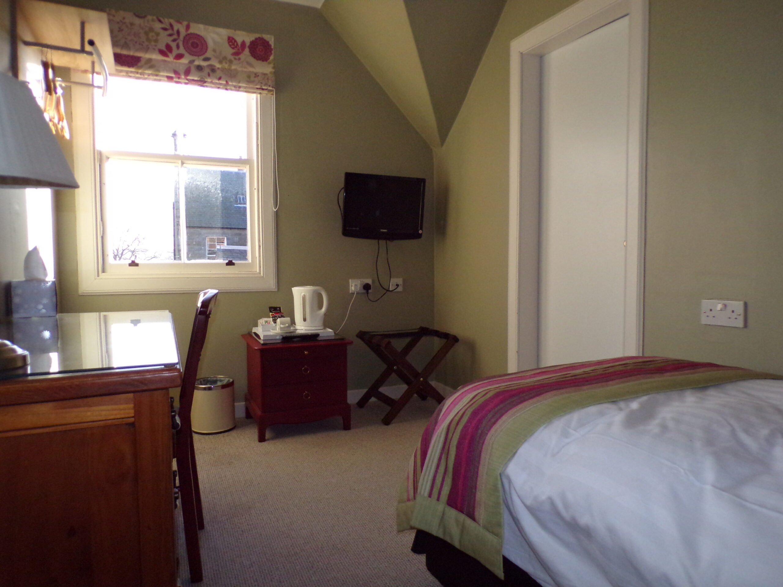 Single room with television and work area