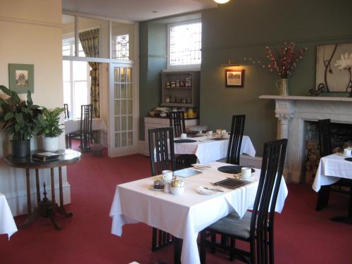 Breakfast tables beside an original fireplace
